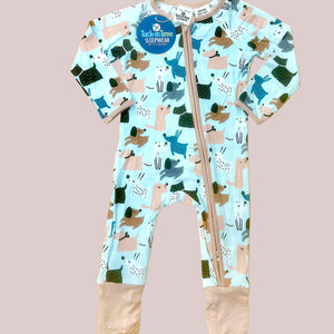 Children's onesie with dog pattern on a wooden surface