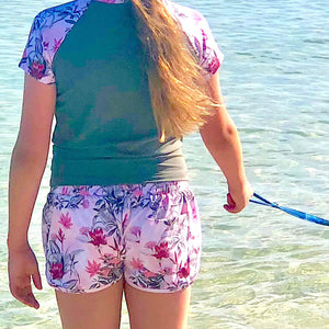 Girl and dog by the water
