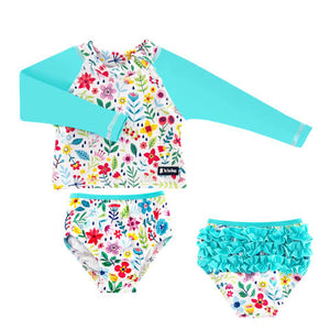 Children's floral swimsuit set with long-sleeve top and ruffled shorts on a white background