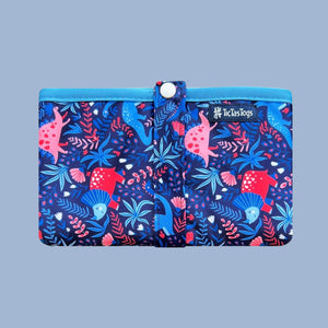 Blue baby change mat with colorful dinosaur pattern on a blue background