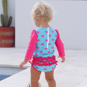 baby-girl-showing-back-of-watermelon-print-swimwear