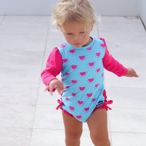 baby-girl-running-in-watermelon-print-swimsuit