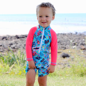 boy-standing-wearing-australian-animals-print-all-in-one-sunsuit
